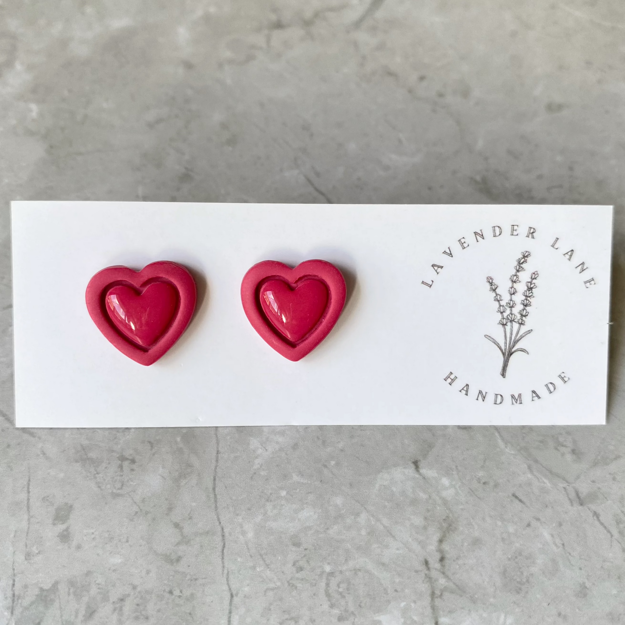 Rosa outline heart studs