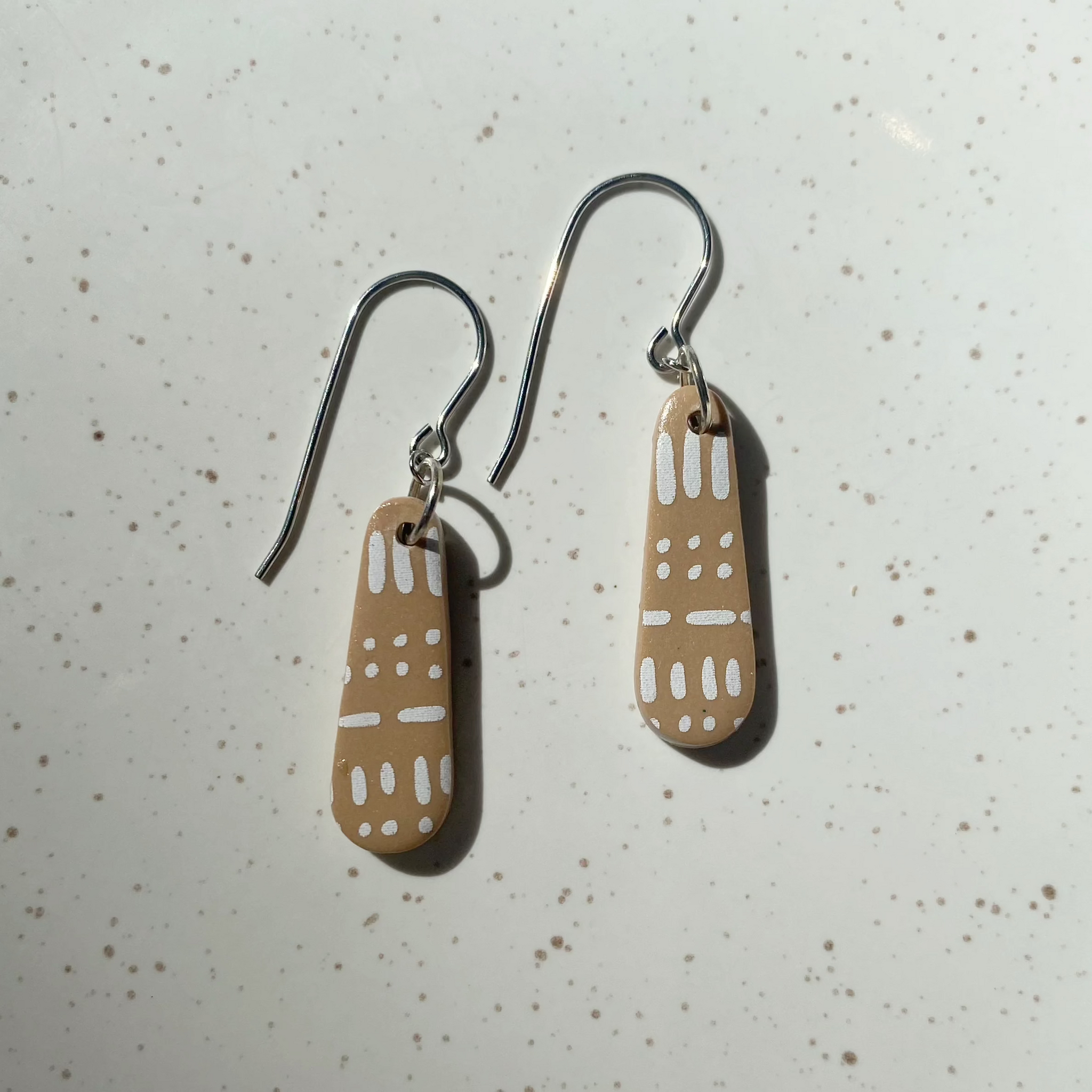 Petra tan drop dangles