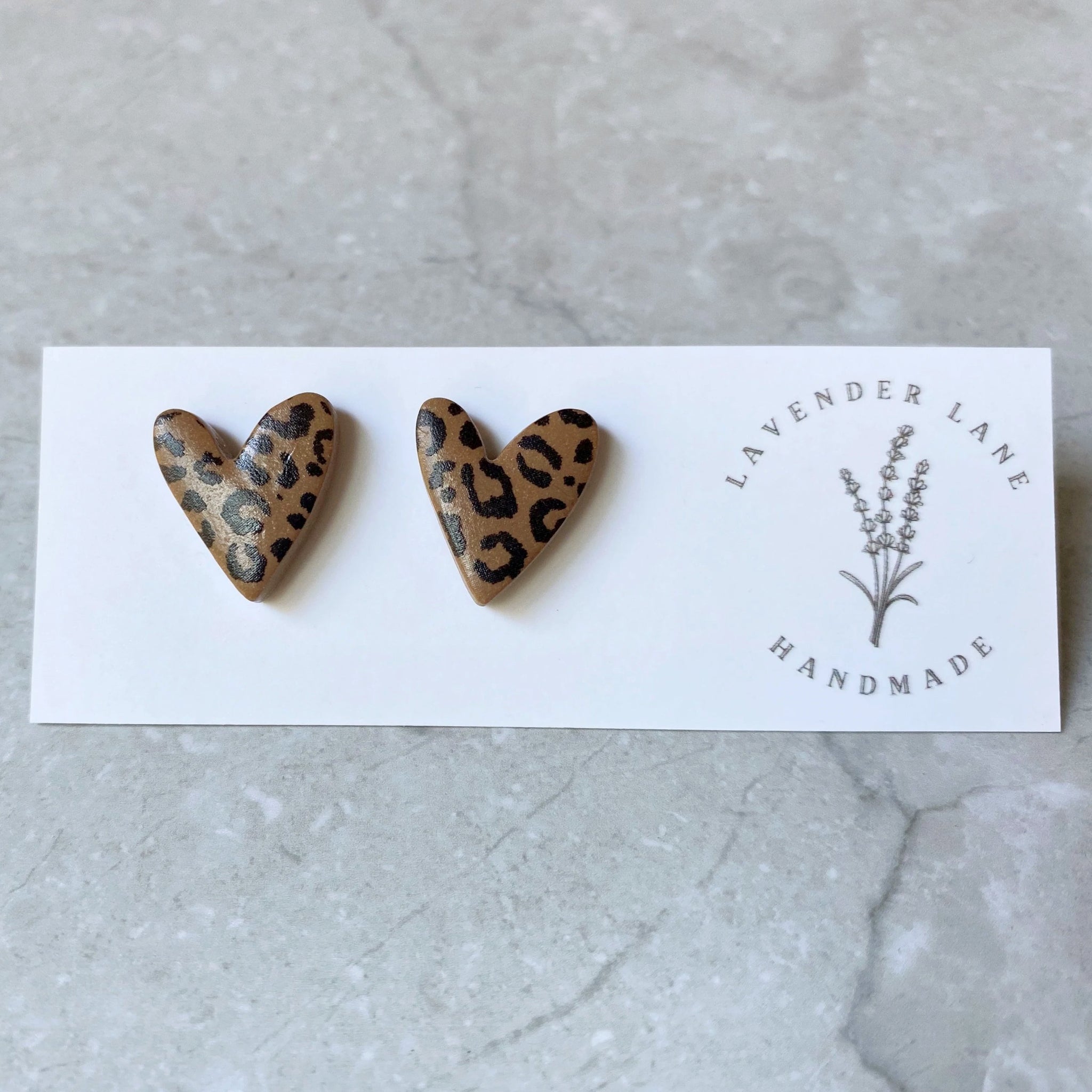 Jenna leopard asymmetrical heart studs