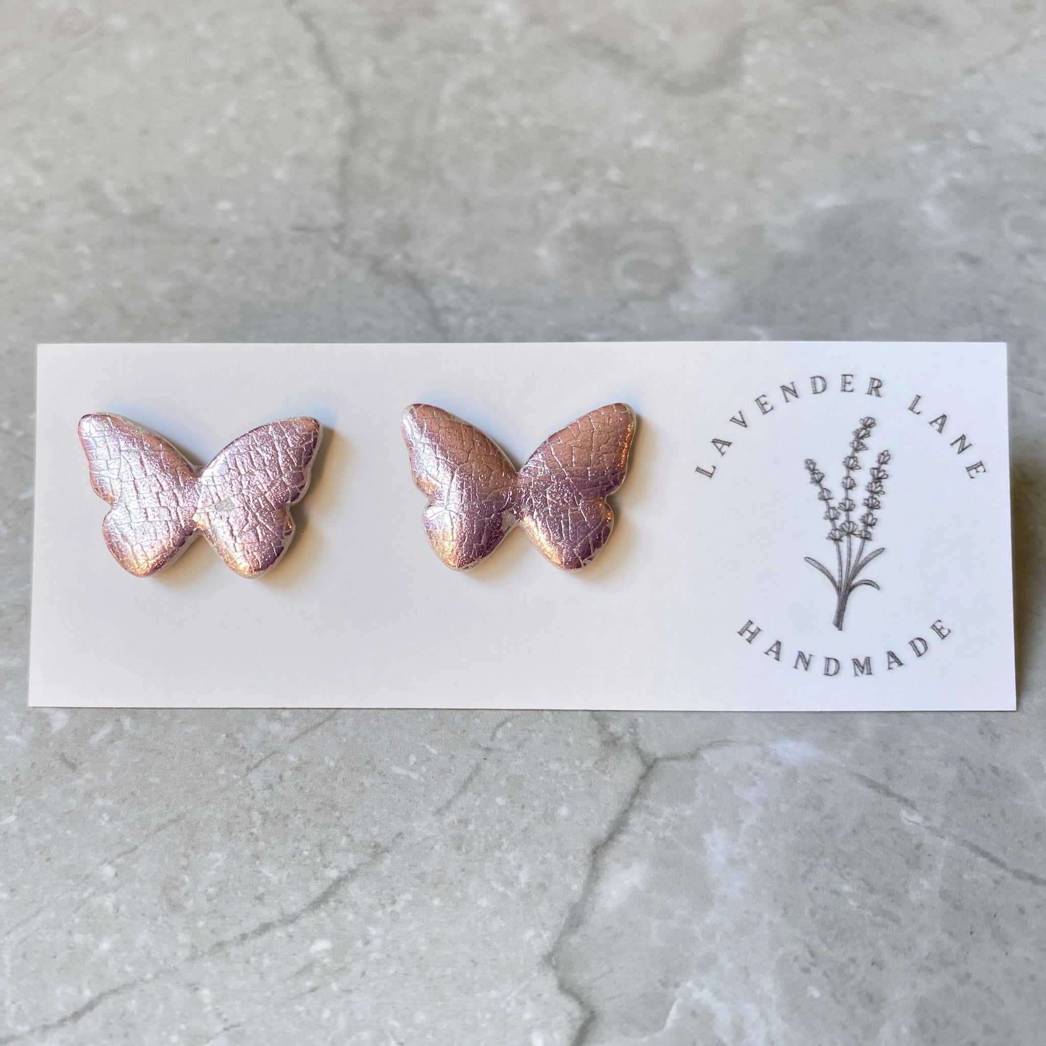 Kiara metallic purple butterfly studs