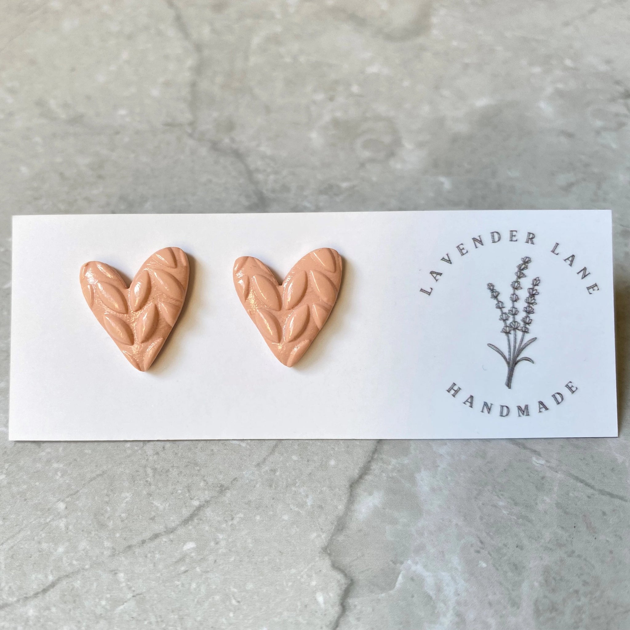 Rosa tan asymmetrical heart studs