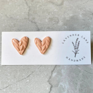 Rosa tan asymmetrical heart studs