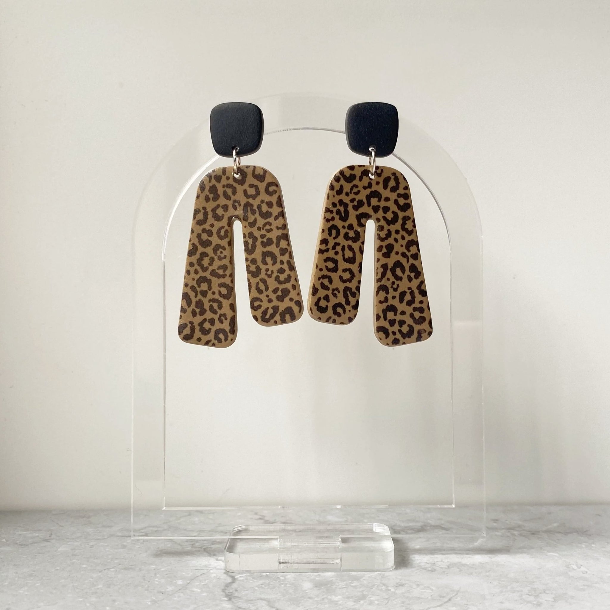 Jenna leopard asymmetrical arch dangles